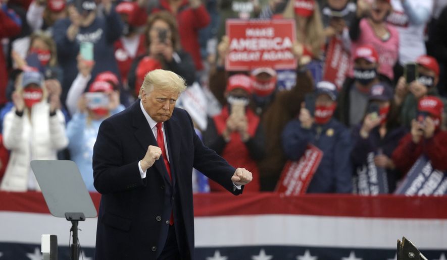 President Donald Trump dances at the conclusion of a campaign rally at Lancaster Airport, Monday, Oct. 26, 2020 in Lititz, Pa. (AP Photo/Jacqueline Larma)