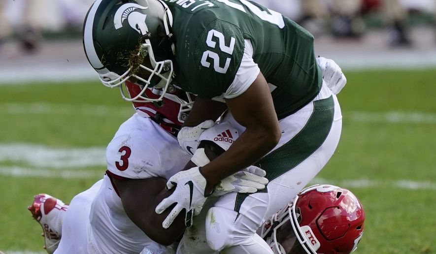 Rutgers linebacker Olakunle Fatukasi (3) knocks the ball away from Michigan State running back Jordan Simmons (22) during the second half of an NCAA college football game, Saturday, Oct. 24, 2020, in East Lansing, Mich. (AP Photo/Carlos Osorio)
