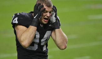 Las Vegas Raiders defensive end Carl Nassib (94) reacts after the Las Vegas Raiders lost to the Tampa Bay Buccaneers in an NFL football game, Sunday, Oct. 25, 2020, in Las Vegas. (AP Photo/David Becker)