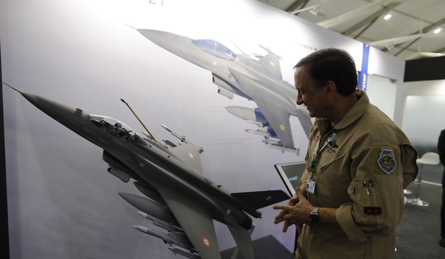 In this Feb. 5, 2020, file photo, an executive with Lockheed Martin&#39;s Air Superiority Programs explains the capabilities of the F-21 fighter jet at the DefExpo in Lucknow, India.  (AP Photo/Rajesh Kumar Singh, File) **FILE**