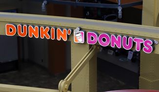 This May 7, 2020, file photo, shows a Dunkin&#39; Donuts at the Greater Pittsburgh International Airport in Moon, Pa. The Dunkin’ doughnuts and coffee chain confirmed it&#39;s held talks to be taken private by a private equity firm, sending shares rocketing to an all-time high at the opening bell Monday, Oct. 26, 2020.(AP Photo/Gene J. Puskar, File)