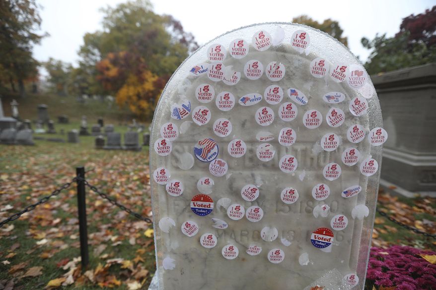 &quot;I Voted Today&quot; stickers cover a protective plastic cover on the headstone of Susan B. Anthony in Mt. Hope Cemetery, Sunday Oct. 25, 2020. in Rochester, N.Y.  (Tina MacIntyre-Yee/Democrat &amp;amp; Chronicle via AP)  **FILE**