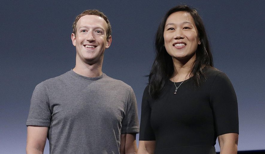 Behind a $350 million donation from Facebook CEO Mark Zuckerberg and his wife, Priscilla Chan, a nonprofit is doling out grants to Georgia state and local election officials for the Jan. 5 Senate runoffs. (AP Photo/Jeff Chiu, File)