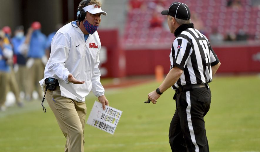 Mississippi coach Lane Kiffin reacts to a call during the second half of an NCAA college football game against Arkansas, Saturday, Oct. 17, 2020, in Fayetteville, Ark. (AP Photo/Michael Woods)