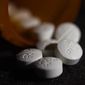 FILE - This Tuesday, Aug. 15, 2017 file photo shows an arrangement of pills of the opioid oxycodone-acetaminophen in New York. On Monday, Oct. 26, 2020, the American Academy of Pediatrics issued new guidance aimed at improving care for women and newborns affected by the mothers’ opioid use. (AP Photo/Patrick Sison)