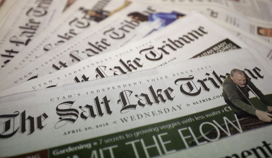 FILE - Copies of The Salt Lake Tribune newspaper are shown on April 20, 2016, 2020, in Salt Lake City. The Salt Lake Tribune will stop printing a daily newspaper after nearly 150 years at the end of the year and move to a weekly print edition. The newspaper reported Monday, Oct. 26, 2020, the change won't result in cuts to the newsroom staff, but nearly 160 people involved with printing and delivering the daily paper will be laid off. (AP Photo/Rick Bowmer, File)