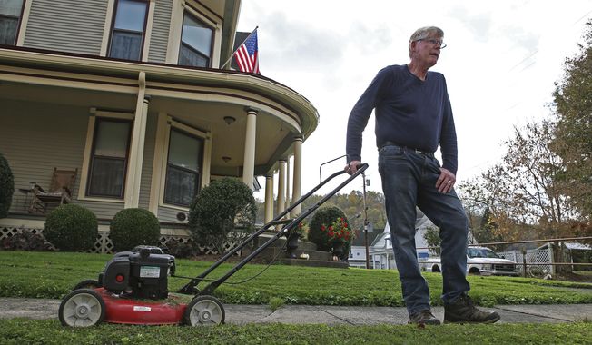 James Musgrave, 61, discusses the increase in cases of the coronavirus in West Union, W.Va., Wednesday Oct. 21, 2020. (AP Photo/Kathleen Batten)