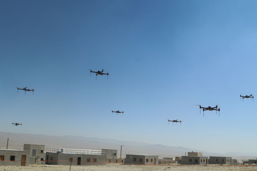 The 11th Armored Cavalry Regiment and the Threat Systems Management Office push a swarm of 40 drones through the town during the battle of Razish, National Training Center on May 8th, 2019. This exercise was the first of many held at the National Training Center. (U.S. Army Photo by Pv2 James Newsome)