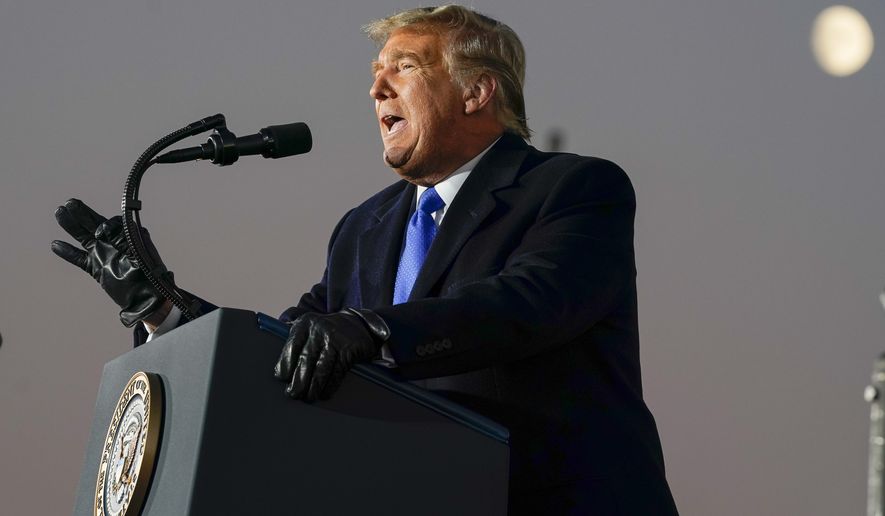 President Donald Trump speaks during a campaign rally at MotorSports Management Company, Tuesday, Oct. 27, 2020, in West Salem, Wis. (AP Photo/Evan Vucci)
