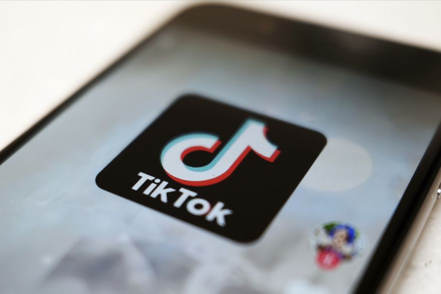 This Monday, Sept. 28, 2020, file photo, shows as logo of a smartphone app TikTok on a user post on a smartphone screen in Tokyo. (AP Photo/Kiichiro Sato, File)