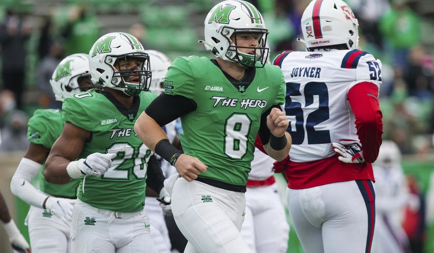 Marshall quarterback Grant Wells (8) and running back Brenden Knox (20) head to the sideline after a touchdown as the Herd takes on Florida Atlantic during an NCAA college football game at Joan C. Edwards Stadium, Saturday, Oct. 24, 2020, in Huntington, W.Va. (Sholten Singer/The Herald-Dispatch via AP)