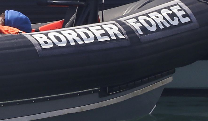 FILE - In this file photo dated Saturday Aug. 8, 2020, a Border Force vessel at the port city of Dover, England. Fifteen migrants have been saved Tuesday Oct. 27, 2020, as search and rescue operations by the Border Force continue, but at least four migrants, including a 5-year-old and 8-year-old child, have died Tuesday when their boat capsized while they and other migrants tried to cross the English Channel to Britain, French authorities said. (AP Photo/Kirsty Wigglesworth, FILE)