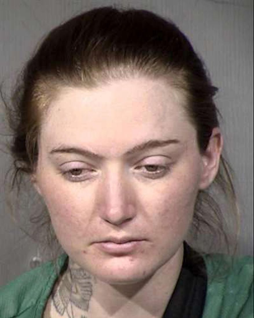 In this photo provided by the Maricopa County Sheriff's Office is Jovana Kelsey McCreary, who authorities say took away an officer's gun and fired one round outside a Phoenix hospital when she was taken out of jail for a medical appointment. No one was injured in the Oct. 20, 2020, shooting, and officers were able to take back the gun. McCreary hasn't yet entered a plea on aggravated assault charges stemming from the shooting. (Maricopa County Sheriff's Office via AP)