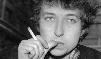 Musician Bob Dylan appears in London on April 27, 1965. Transcripts of lost 1971 Dylan interviews with the late American blues artist Tony Glover and letters the two exchanged reveal that Dylan changed his name from Robert Zimmerman because he worried about anti-Semitism, and that he wrote &amp;quot;Lay Lady Lay&amp;quot; for actress Barbra Streisand. The items are among a trove of Dylan archives being auctioned in November 2020, by Boston-based R.R. Auction. (AP Photo, File)