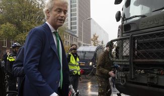 FILE - In this file photo dated Wednesday, Oct. 16, 2019, Dutch far-right leader Geert Wilders passes army trucks blocking the roads to prevent protesting farmers from reaching parliament in The Hague, Netherlands. Turkish President Recep Tayyip Erdogan is suing Dutch lawmaker Geert Wilders after the anti-Islam politician posted a series of tweets against the Turkish leader, including one that described him as a “terrorist” according to Turkey&#39;s state-run news agency Tuesday Oct. 27, 2020. (AP Photo/Peter Dejong, FILE)