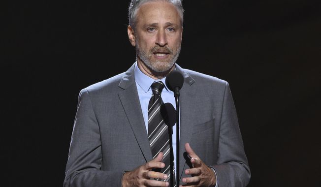 FILE- Jon Stewart presents the Pat Tillman award for service on July 18, 2018, at the ESPY Awards in Los Angeles. Stewart will return to television as host of an Apple TV+ public affairs show, the streaming service said Tuesday, Oct. 27, 2020. (Photo by Phil McCarten/Invision/AP, File)