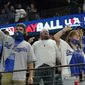 Los Angeles Dodgers fans cheer during the seventh inning in Game 5 of the baseball World Series against the Tampa Bay Rays Sunday, Oct. 25, 2020, in Arlington, Texas. (AP Photo/Eric Gay)