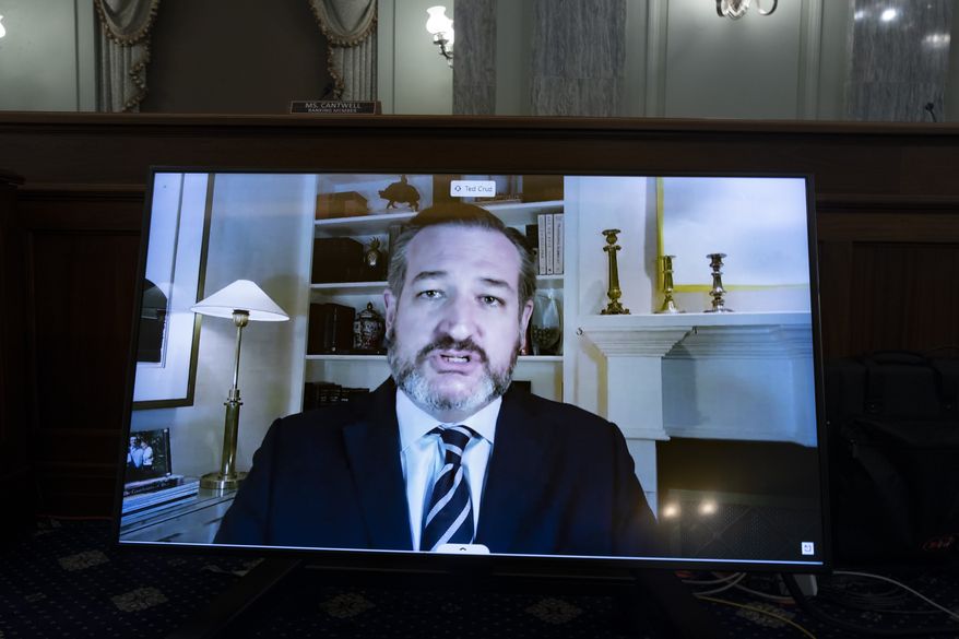 Sen. Ted Cruz, R-Texas, appears on a screen as he speaks remotely during a hearing before the Senate Commerce Committee on Capitol Hill, Wednesday, Oct. 28, 2020, in Washington. The committee summoned the CEOs of Twitter, Facebook and Google to testify during the hearing. (Michael Reynolds/Pool via AP)