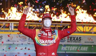 Kyle Busch celebrates in Victory Lane after winning the NASCAR Cup Series auto race at Texas Motor Speedway in Fort Worth, Texas, Wednesday, Oct. 28, 2020. (AP Photo/Richard W. Rodriguez)
