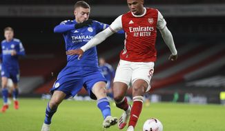 Leicester&#39;s Jamie Vardy, left, tackles Arsenal&#39;s Gabriel during the English Premier League soccer match between Arsenal and Leicester City at Emirates Stadium in London, England, Sunday, Oct. 25, 2020. (AP Photo/Ian Walton,Pool)