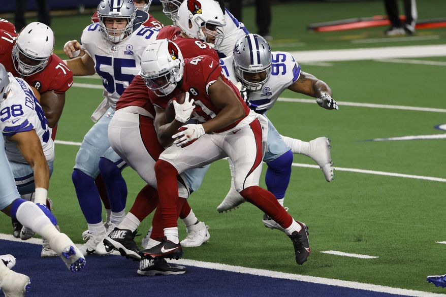 Arizona Cardinals running back Kenyan Drake (41) breaks into the end zone for a touchdown in the first half of an NFL football game as Dallas Cowboys' Leighton Vander Esch (55) and Dontari Poe (95) defend in Arlington, Texas, Monday, Oct. 19, 2020. (AP Photo/Ron Jenkins)