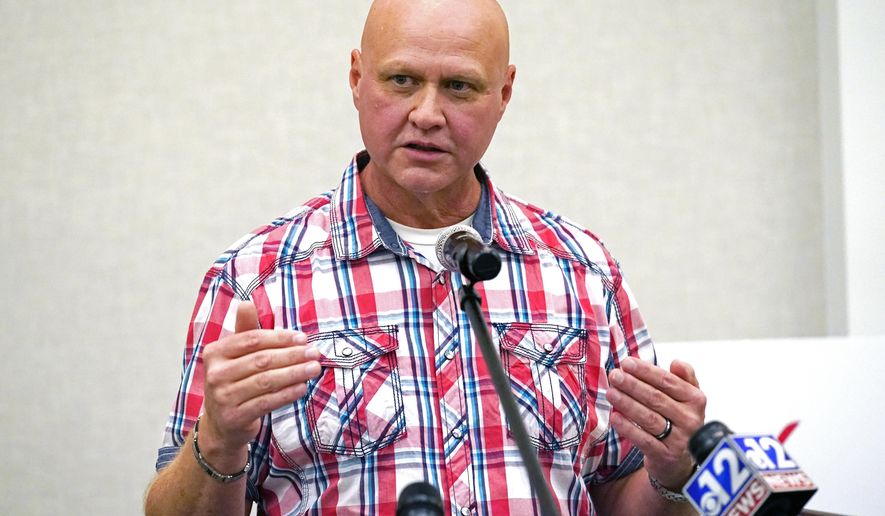 Ronnie Pollard, a former lieutenant with the DeSoto County Sheriff's Department, explains why he is in support of Initiative 65, a strictly regulated medical marijuana program, that is on the general election ballot this November, during a Wednesday, Oct. 22, 2020 news conference in Jackson, Miss. (AP Photo/Rogelio V. Solis)