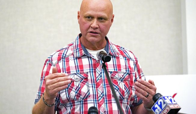 Ronnie Pollard, a former lieutenant with the DeSoto County Sheriff's Department, explains why he is in support of Initiative 65, a strictly regulated medical marijuana program, that is on the general election ballot this November, during a Wednesday, Oct. 22, 2020 news conference in Jackson, Miss. (AP Photo/Rogelio V. Solis)