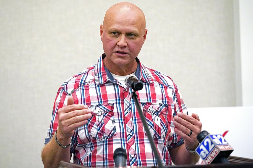 Ronnie Pollard, a former lieutenant with the DeSoto County Sheriff's Department, explains why he is in support of Initiative 65, a strictly regulated medical marijuana program, that is on the general election ballot this November, during a Wednesday, Oct. 22, 2020 news conference in Jackson, Miss. (AP Photo/Rogelio V. Solis)