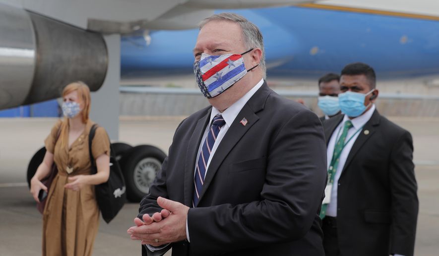 In this file photo, U.S. Secretary of State Mike Pompeo walks to board an aircraft to leave for Maldives, in Colombo, Sri Lanka, Wednesday, Oct. 28, 2020. On Wednesday, the State Department that Mr. Pompeo will travel to Hanoi to &quot;reaffirm the strength of the U.S.-Vietnam comprehensive partnership and promote our shared commitment to a peaceful and prosperous region.&quot;  (AP Photo/Eranga Jayawardena, Pool)  **FILE**