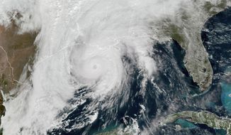 This GOES-16 GeoColor satellite image taken, Wednesday, Oct. 28, 2020, at 1 p.m. EDT, and provided by NOAA, shows Hurricane Zeta in the Gulf of Mexico nearing Louisiana.  (NOAA via AP)