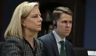 This March 27, 2018, provided by the Department of Homeland Security, then-Secretary of Homeland Security Kirstjen Nielsen and then-Department of Homeland Security chief of staff Miles Taylor, right, meet with Honduran President Juan Hernandez, not pictured, and security ministers from the Northern Triangle countries in Tegucigalpa, Honduras. Taylor, a former Trump administration official who penned a scathing anti-Trump op-ed and book under the pen name “Anonymous” made his identify public Wednesday, Oct. 28, 2020. (Tim Godbee/Department of Homeland Security via AP)