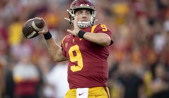 FILE - In this Nov. 2, 2019 file photo, Southern California quarterback Kedon Slovis throws a pass during the first half of an NCAA college football game against Oregon in Los Angeles. Slovis returns s quarterback for his sophomore season in November.  (AP Photo/Kyusung Gong, File)