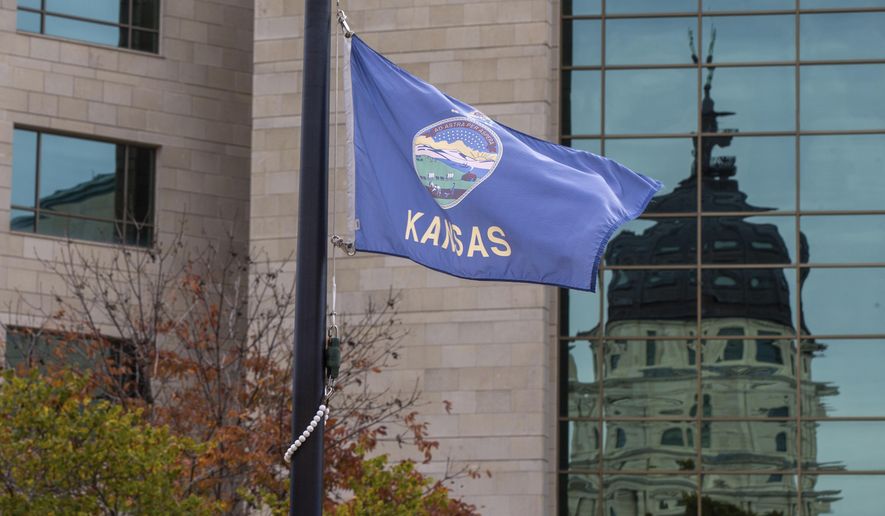 Kansas Gov. Laura Kelly announced Wednesday, Oct. 28, 2020 that flags would be flown at half-mast in honor the more than 1,000 Kansans who have died due to COVID-19 complications. (Evert Nelson/The Capital-Journal via AP)