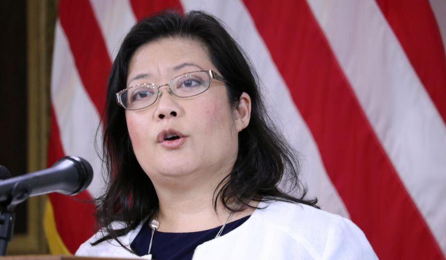 FILE - In this Aug. 27, 2020 file photo, Dr. Jinlene Chan, Maryland's acting deputy health secretary, announces that the state health department believes all schools in Maryland can move forward with some level of in-person learning, after examining metrics related to the coronavirus during a news conference in Annapolis, Md. Chan said the state will conduct an outreach effort to promote trust in a coronavirus vaccine when one becomes available. Chan told a panel of state lawmakers Wednesday, Oct. 28 that state health officials recognize they will need to provide facts and answer questions people have to instill confidence when a vaccine is ready. (AP Photo/Brian Witte, File)