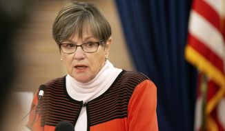 Kansas Gov. Laura Kelly updates the state on COVID-19 cases during a press conference, Wednesday, Oct. 28, 2020, at the Statehouse in Topeka, Kan. (Evert Nelson/The Topeka Capital-Journal via AP)