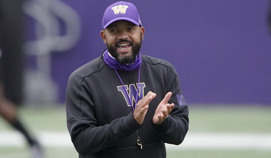 Washington head coach Jimmy Lake calls to his team during NCAA college football practice, Friday, Oct. 16, 2020, in Seattle. (AP Photo/Ted S. Warren)