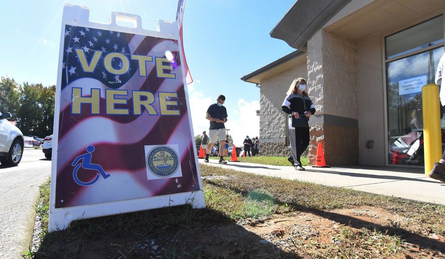 Voters wait in line to vote at the Hamilton County Election Commission, Thursday Oct. 29, 2020 on the final day for early voting in Chattanooga, Tenn. (Matt Hamilton /Chattanooga Times Free Press via AP)