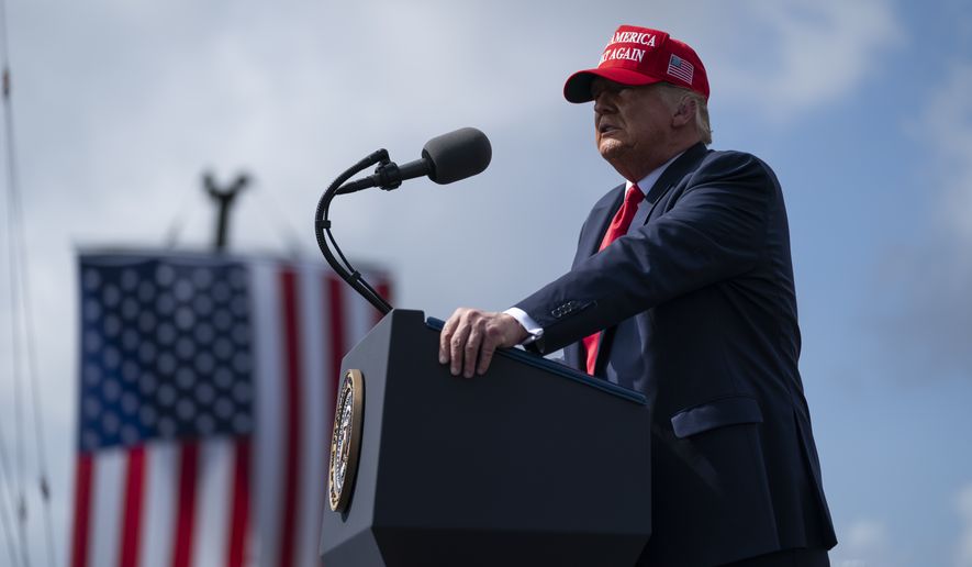 President Donald Trump speaks during a campaign rally outside Raymond James Stadium, Thursday, Oct. 29, 2020, in Tampa. (AP Photo/Evan Vucci)