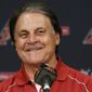 FILE - In this July 22, 2014, file photo, Arizona Diamondbacks Chief Baseball Officer Tony La Russa smiles as he talks about his upcoming induction ceremony into the Baseball Hall of Fame during a news conference in Phoenix. La Russa, the Hall of Famer who won a World Series championship with the Oakland Athletics and two more with the St. Louis Cardinals, is returning to manage the Chicago White Sox 34 years after they fired him, the team announced Thursday, Oct. 29, 2020. (AP Photo/File)