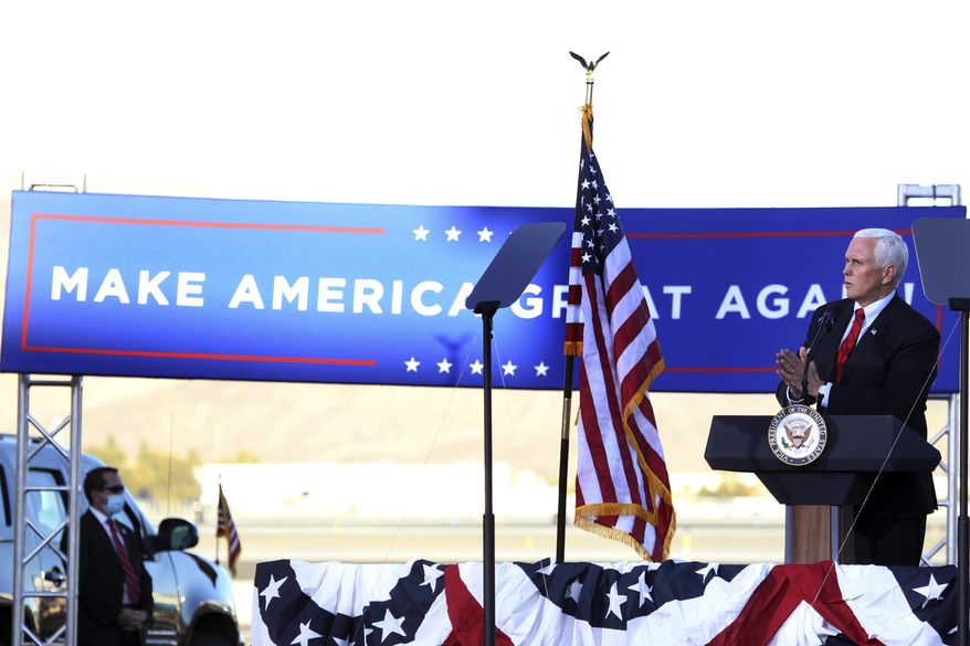 Vice President Mike Pence speaks at a campaign rally at the Reno-Tahoe International Airport in Reno, Nev., Thursday, Oct. 29, 2020. (AP Photo/Lance Iversen)