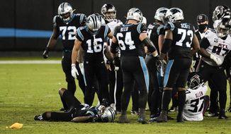 Carolina Panthers quarterback Teddy Bridgewater is injured on the field during the second of an NFL football game against the Atlanta Falcons Thursday, Oct. 29, 2020, in Charlotte, N.C. (AP Photo/Gerry Broome)