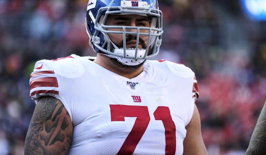 FILE - In this Dec. 22, 2019, file photo, New York Giants offensive guard Will Hernandez stands on the field during the team's NFL football game against the Washington Redskins in Landover, Md. Hernandez, who has started every game since being draft in 2018, was placed on the reserve COVID-19 list on Thursday, Oct. 29, after testing positive for the virus. (AP Photo/Mark Tenally, File)