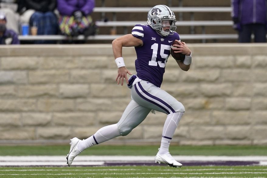 Kansas State quarterback Will Howard runs the ball during the first half of an NCAA football game against Kansas Saturday, Oct. 24, 2020, in Manhattan, Kan. (AP Photo/Charlie Riedel)