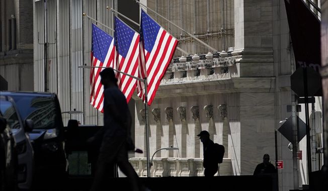 FILE - In this Oct. 14, 2020 file photo, pedestrians pass the New York Stock Exchange. After Donald Trump shocked markets by winning the presidency four years ago, investors quickly agreed on which stocks would benefit most from his election. But four years later, many of those stocks have since faded back, and stocks that were afterthoughts have become the market&#x27;s leaders.   (AP Photo/Frank Franklin II)