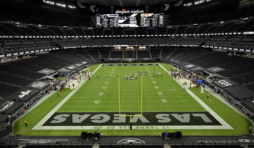 FILE- In this Sept. 21, 2020, file photo, the Las Vegas Raiders play against the New Orleans Saints during an NFL football game in Las Vegas. The Raiders were the first team to play inside Allegiant Stadium. But the UNLV Rebels will be the first team to play with fans inside the $2 billion dollar venue, when they host in-state rival Nevada on Saturday, Oct. 31, 2020. (AP Photo/David Becker, File)
