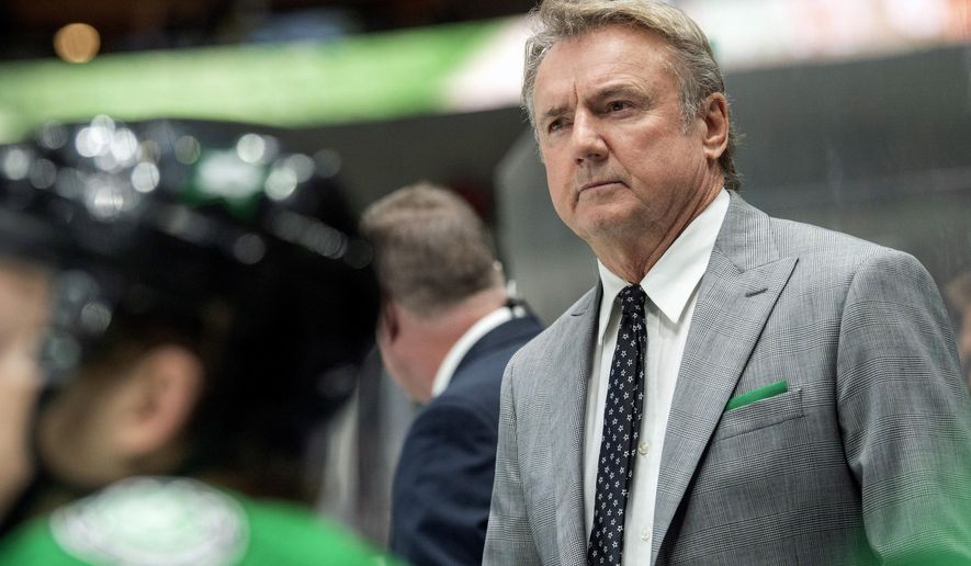 FILE- In this Dec. 10, 2019, file photo, Dallas Stars interim head coach Rick Bowness watches play from behind the bench during the third period of an NHL hockey game against the New Jersey Devils in Dallas. The Stars, on Thursday, Oct. 29, 2020, have officially removed the interim tag from Bowness, the coach who led them to the Stanley Cup Final. (AP Photo/Jeffrey McWhorter, File)