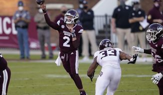 Mississippi State quarterback Will Rogers (2) passes under pressure from Texas A&amp;amp;M linebacker Aaron Hansford (33) during the second half of an NCAA college football game in Starkville, Miss., Saturday, Oct. 17, 2020. (AP Photo/Rogelio V. Solis)