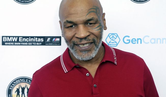 FILE - In this Aug. 2, 2019, file photo, Mike Tyson attends a celebrity golf tournament in Dana Point, Calif. Tyson and Roy Jones Jr. got permission from California&#x27;s athletic commission to return to the boxing ring next month because their fight would be strictly an exhibition of their once-unparalleled skills. (Photo by Willy Sanjuan/Invision/AP, File)