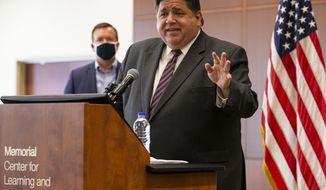 FILE - In this Sept. 21, 2020, Illinois Gov. J.B. Pritzker speaks in Springfield, Ill. Central and west-central Illinois, including the capital city, became the latest region of the state to face restrictions on social interaction Thursday, Oct. 29, 2020, because of an elevated rate of positive tests for COVID-19. The Region 3 restrictions which take effect Sunday, halt indoor bar and restaurant service, closes those establishments at 11 p.m. and limits the size of gatherings to 25 people or 25% of a room&#39;s capacity. (Justin L. Fowler/The State Journal-Register via AP)