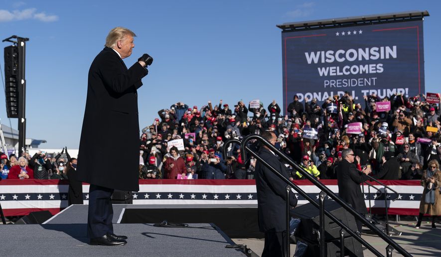 President Donald Trump arrives to speak at a campaign rally at Green Bay Austin Straubel International Airport, Friday, Oct. 30, 2020, in Green Bay, Wis. (AP Photo/Alex Brandon)